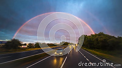 Encounter a double rainbow while driving at high speed Editorial Stock Photo