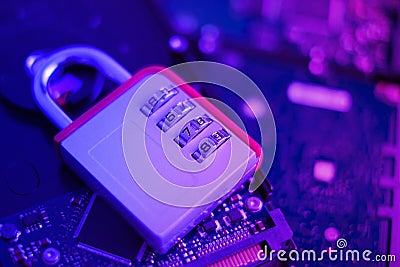 Encrypted hard disk. Padlock with cipher on an opened hard disk. Data loss. computer motherboard. the concept of data Stock Photo