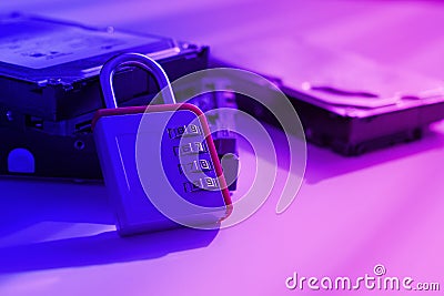 Encrypted hard disk. Padlock with cipher on an opened hard disk. Data loss. computer motherboard. the concept of data Stock Photo