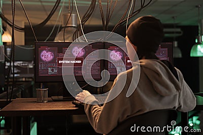 Encryption specialist looking at alert message to hack system Stock Photo