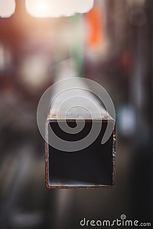 The end part of a metal beam of square shape Stock Photo