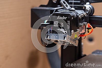 Ender brand 3D printer model moving print head extruder part closeup detail, nobody. 3D printing and printer models for self Editorial Stock Photo