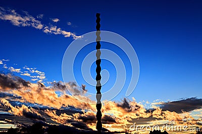 Endless Column of Constantin BrÃ¢ncuÈ™i at sunset Editorial Stock Photo