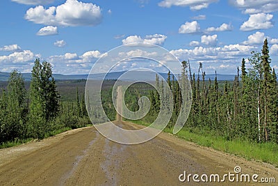 Endless Dalton Highway with mountains, leading from Fairbanks to Prudhoe Bay, Alaska, USA Stock Photo