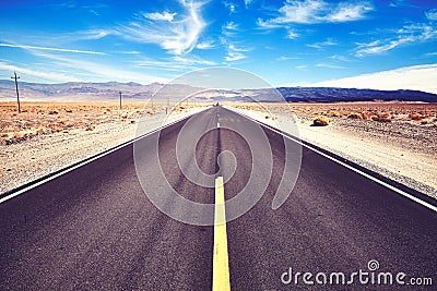 Endless desert road in the Death Valley, USA. Stock Photo