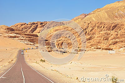 Endless Desert Road with Mountains. Stock Photo