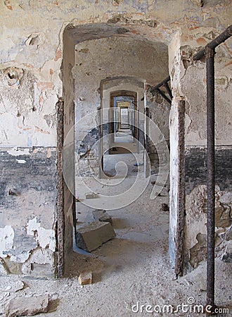 Endless doors in vintage old ruined building with damaged plaster walls Stock Photo
