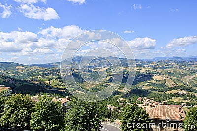 Endless fields and weightless clouds on a sunny summer day. Stock Photo