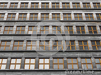 Endless repeated identical windows in a communist style building Stock Photo