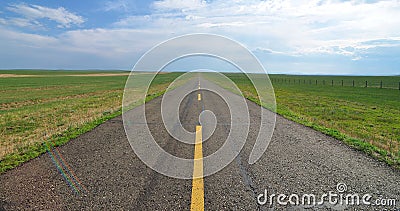 Endless road in the grassland Stock Photo