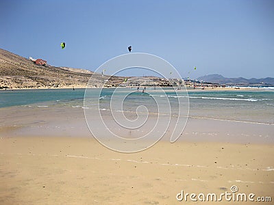 Endless wide tideland in the lagoon with kite surfers of Gorriones, Playa de Sotavento, Costa calma, Fuerteventura, Spain Stock Photo