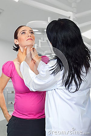 Endocrinologist checking tyroide woman Stock Photo