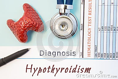 Endocrinology diagnosis Hypothyroidism. Figure of thyroid gland, result of laboratory analysis of blood, medical stethoscope and b Stock Photo
