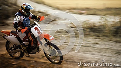 Enduro bike racing along dirt track Stock Photo