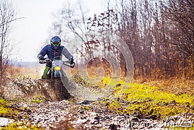 Enduro bike rider on dirt track Stock Photo