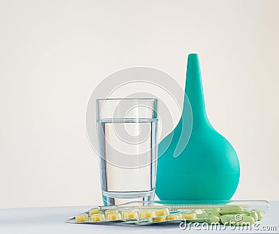 Enema and medicines in tablets Stock Photo