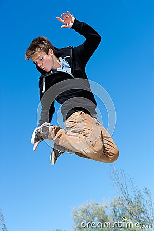 Energetic boy jumping. Stock Photo
