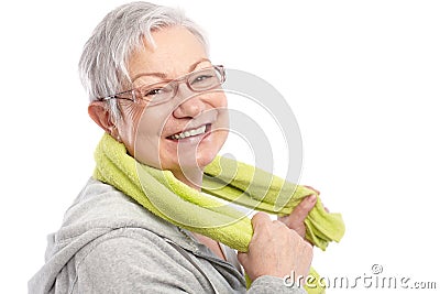 Energetic old woman smiling after workout Stock Photo