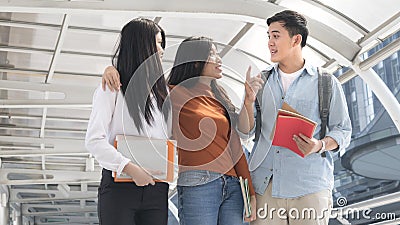 Energetic optimistic teen people and business woman walk and talk at outdoor public Stock Photo