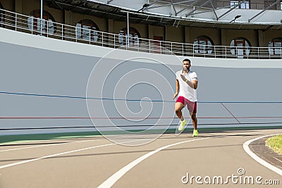 Energetic purposeful fit young man in sportswear Stock Photo