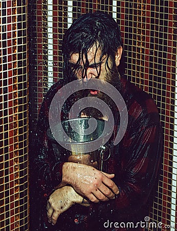 Energized man with metal bucket Stock Photo