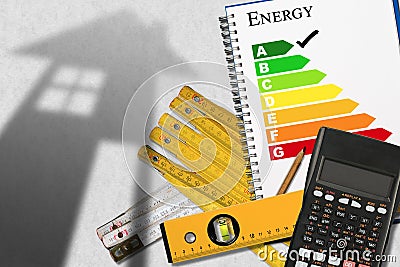 Energy Efficiency Rating with Calculator and House Stock Photo