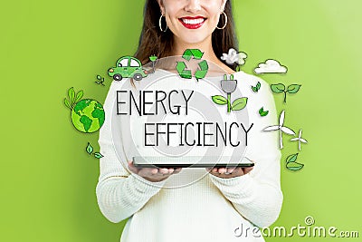 Energy Efficiency with woman holding a tablet Stock Photo