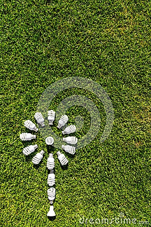 Energy efficient light bulbs on green grass Stock Photo