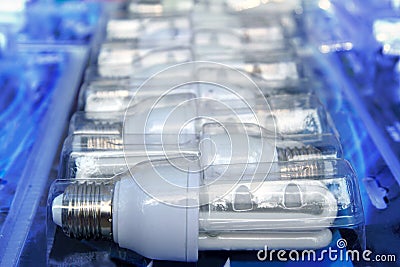 Energy saver light bulbs row new in blister Stock Photo