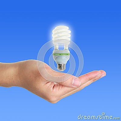 Energy Saving Lamp Above Hand Stock Photo