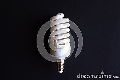Energy saving light bulb lamp on black background Stock Photo