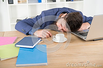 Energy and tiredness. boss fell asleep on table. Man sleep over workplace. coffee will help. bored and exhausted guy Stock Photo