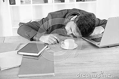 Energy and tiredness. boss fell asleep on table. Man sleep over workplace. coffee will help. bored and exhausted guy Stock Photo