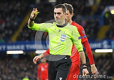 Clement Turpin shows a yellow card Editorial Stock Photo