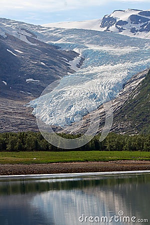 Engabreen arm of Svartisen glacier mirroring in the sea Stock Photo