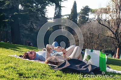 Engaged couple are relaxing on the green lawn Editorial Stock Photo