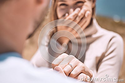 Engagement, proposal and romance wth a man asking his fiance to marry him while dating and spending time together Stock Photo