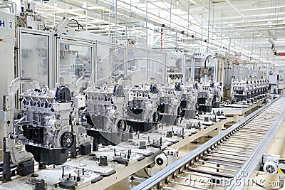 Automated production line with new engines in car factory Stock Photo