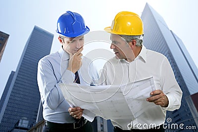 Engineer architect two expertise team plan hardhat Stock Photo