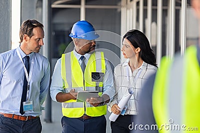 Engineer and architects at construction site Stock Photo