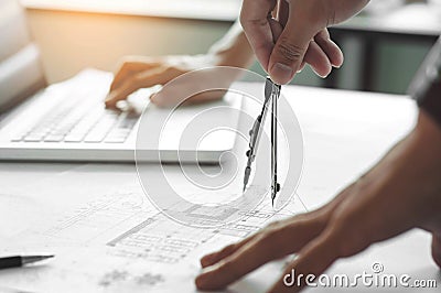 Engineer architects discussing on the table with blueprint Stock Photo