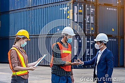 Engineer assistant inspector protect body by wearing mask,helmet and wash hand with alcohol Before entering warehouse or factory Stock Photo