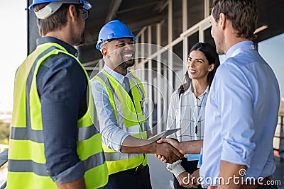 Engineer and businessman handshake at construction site Stock Photo
