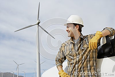Engineer By Car At Wind Farm Stock Photo
