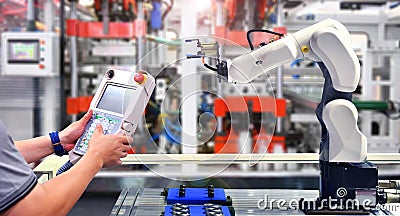 Engineer check and control automation Robot arm Stock Photo