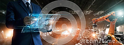 Engineer check and control welding robotics automatic arms machine in factory automotive industrial with monitoring system Stock Photo