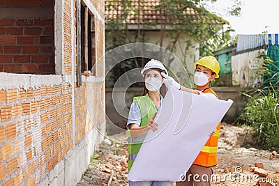 Engineer concept The male and female engineering coworkers looking and figuring out about the building construction Stock Photo