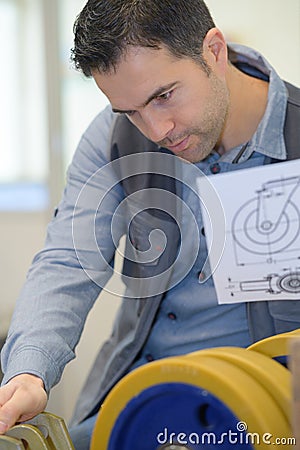 engineer designer with drawing Stock Photo