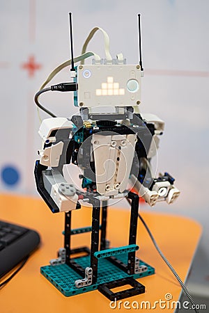 an engineer designs robots and programs them for various tasks Editorial Stock Photo