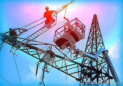 Engineer Electrician Workers On Lift Repairing Electricity Pylon Powerline And Wires Stock Photo